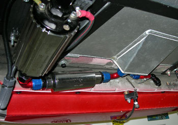 underneath fuel cell showing pump, pre-filter, drain line. Also shown is the parachute release line stored position.