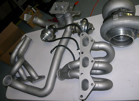 Stainless exhaust manifolds with ceramic titanium heat performance coating