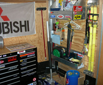 right forward of race trailer with fuel, race jack, cleaning, shirts, straps and more