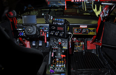 Full view of racecar cab controls from rear.