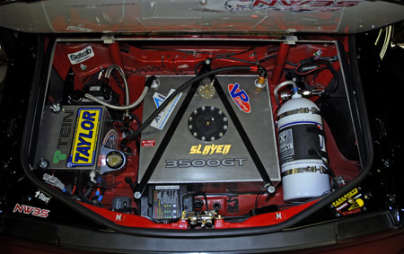 View of trunk showing battery system, shore charger, fuel cell, fuel cooler, nitrous tank and system.