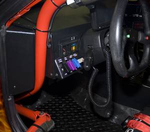Driver controls for clutch safety override, line lock brake locking system enable and hold (on wheel), Aeromotive fuel pump controller override, fuel level and cooling system indicator lights