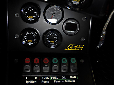 lower race controls and gauges for ignition, fuel pump and fan controls, monitoring pressures.